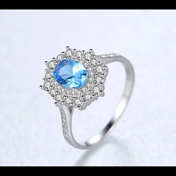 925 Sterling Silver With White Gold Plated Delicate Blue Topaz Oval Band Ring - Picture 1 of 4